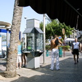 Mallorca, Spain. Payphone with cell phone user nearby