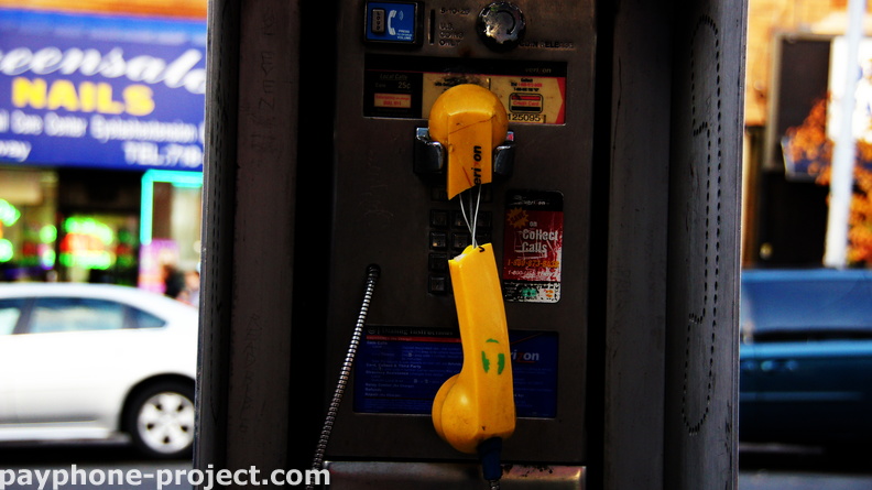 Battered and bedraggled. This payphone was recently removed.