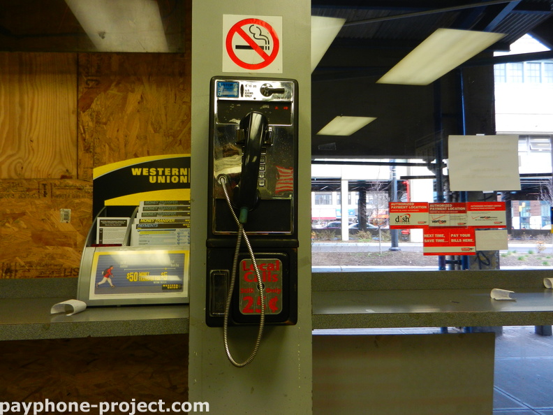Ghost payphone inside a Queens Plaza check cashing place.
