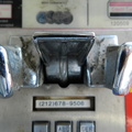 (212) 678-9506 is the phone number for the payphone inside one of the last outdoor, free-standing phone booths in New York City.
