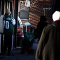 New York Jets fan using a payphone.
