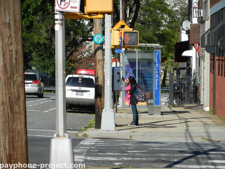 People Using New York City Payphones.