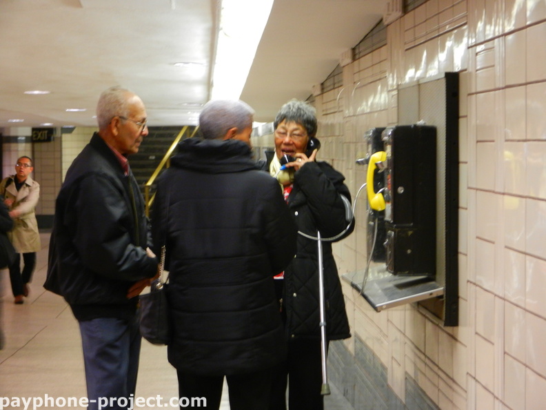 People Using New York City Payphones.