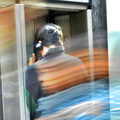 Talking on a midtown payphone as a blur of humanity passes by (2962 visits) Talking on a midtown payphone as a blur of humanity passes by