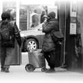 Talking on an American Payphone as snow starts to fall.