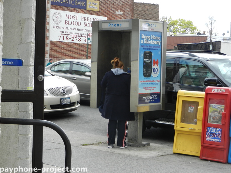 People Using New York City Payphones.