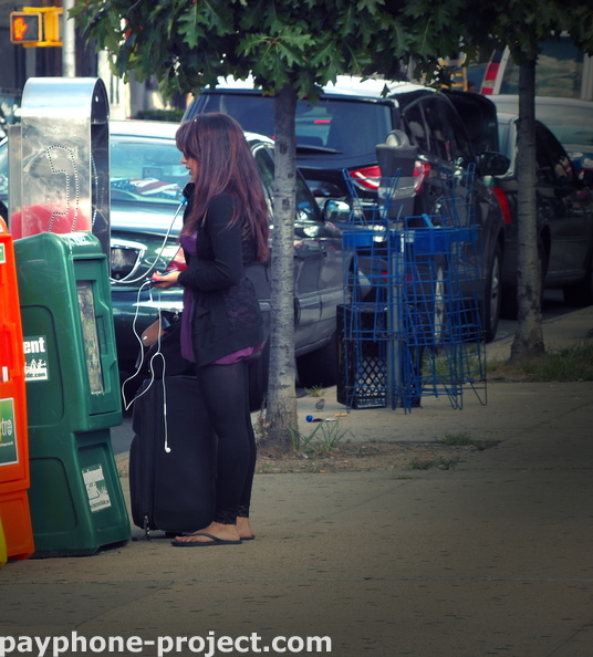 Stranded tourists still use payphones