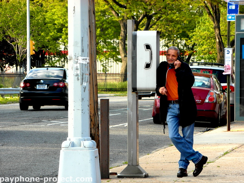 Talking on a Van Wagner Payphone
