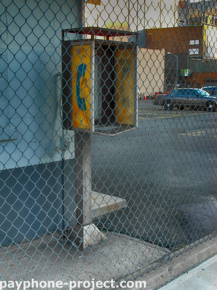 Jackson Ave. and Orchard Street. Abandoned Payphonew Carcass.