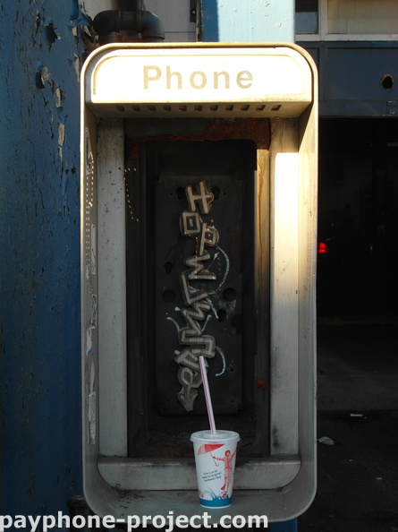 Gutted out payphone enclosure, Queens Boulevard.