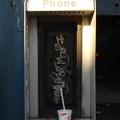 Gutted out payphone enclosure, Queens Boulevard.