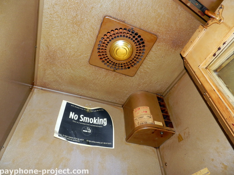 Inside a New York City Phone Booth.