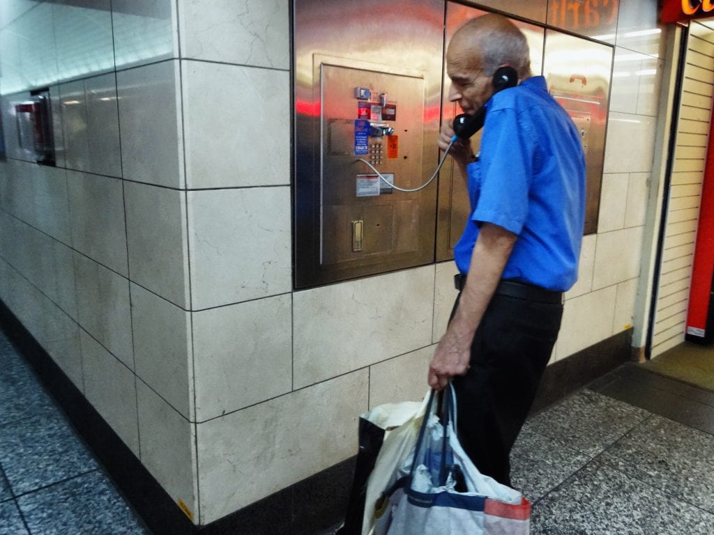Action Shot: Penn Station Payphone User