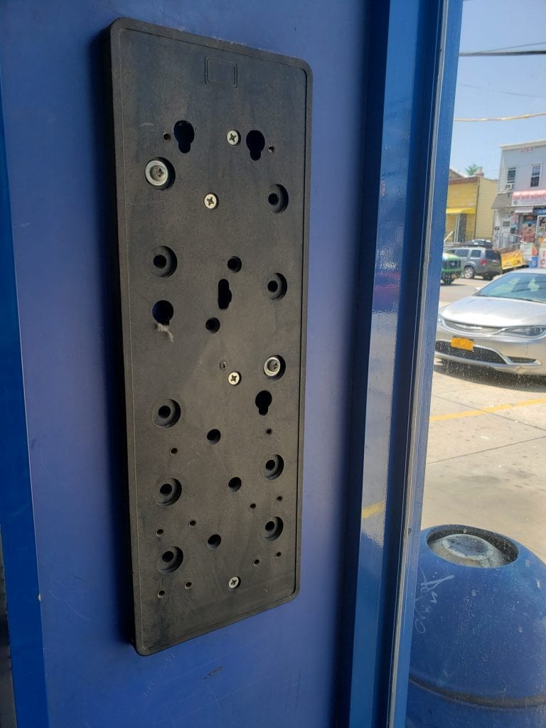 Payphone Mounting Backplate at an Elmhurst Laundromat