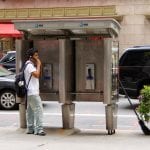 Dude Using a Midtown Payphone. July, 2011.