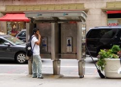 Dude Talking on a Midtown Payphone