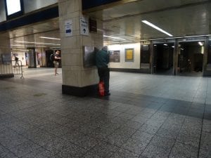 Action shot. Penn Station's payphones get a lot of usage.